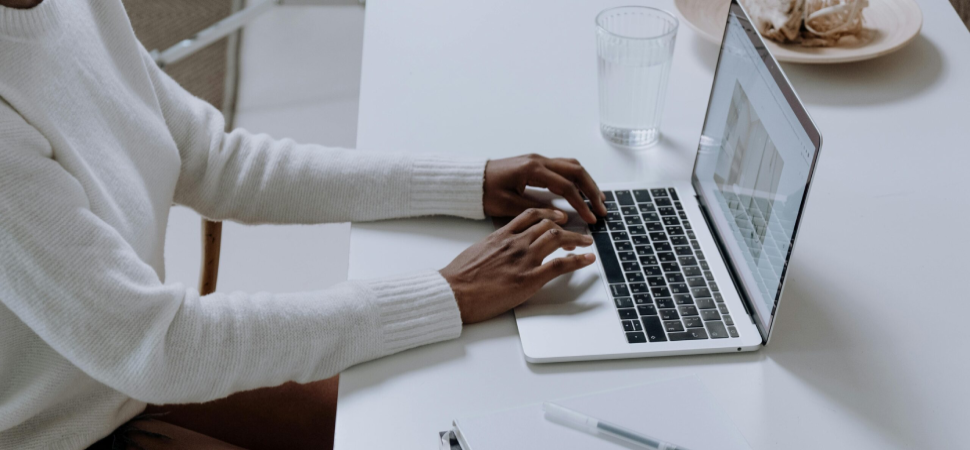 Person working on a laptop improving website design and performance